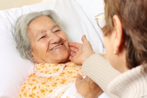 nurse checking an elderly woman's health